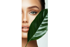 Beautiful woman with leaf close-up, a Beauty & Fashion Photo by Beautiful things