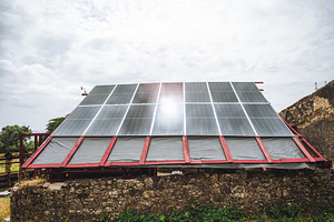 Solar Roof On Rustic Ruin, a Technology Photo by SkyNext
