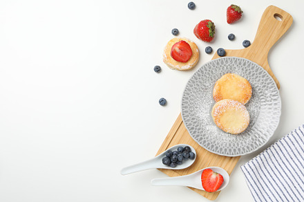 Concept of tasty sweet food, cheese pancakes, space for text, a Food & Drink Photo by AtlasStudio PRO