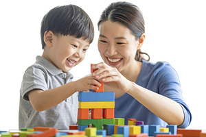 Child and mother building with blocks isolated photo, a School & Education Photo by DanFLCreativo