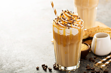 Iced caramel latte coffee in a tall glass featuring iced, caramel, and latte, a Food & Drink Photo by farwasser