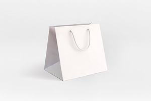 white luxury take away paper bag, a Beauty & Fashion Photo by UN-BRANDED