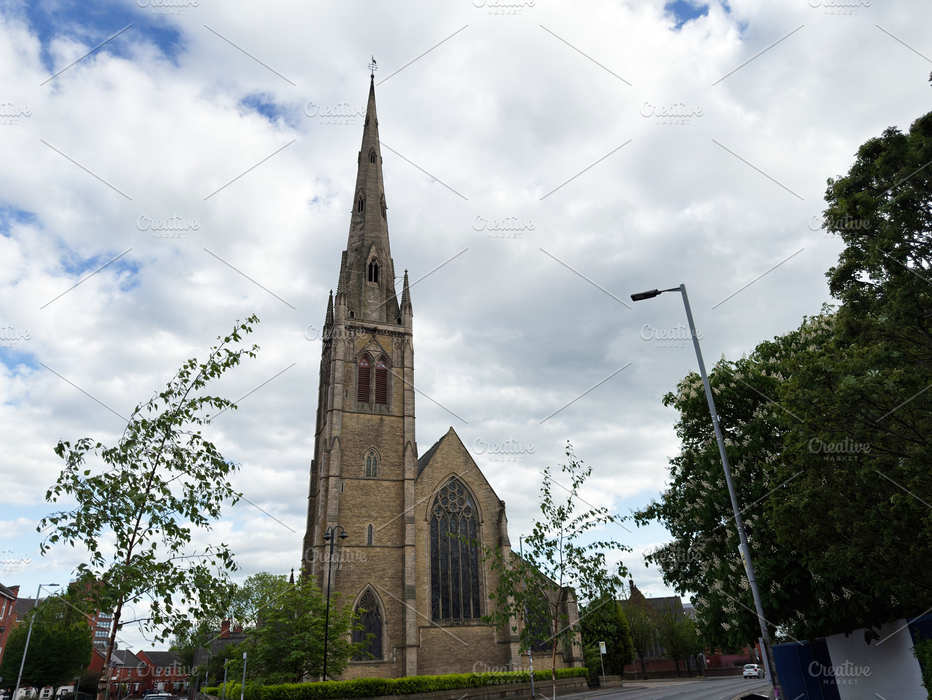 Gothic St Mary, Hulme church with tall spire and stone façade i, a Photo by AS photostudio