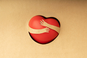 Love Yourself Concept. Paper Cut as Arms Embracing a Red Heart S, a Person Photo by salmon.black