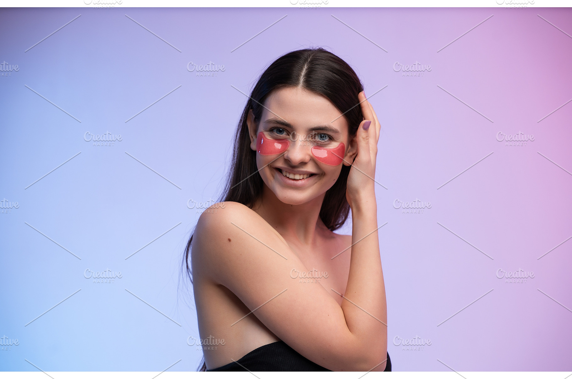 Young woman smiling while applying, a Health & Medical Photo by volodymyrshtun13795