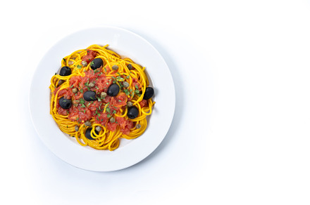 Italian Pasta puttanesca with tomato sauce, capers, and black ol, a Food & Drink Photo by etorres69