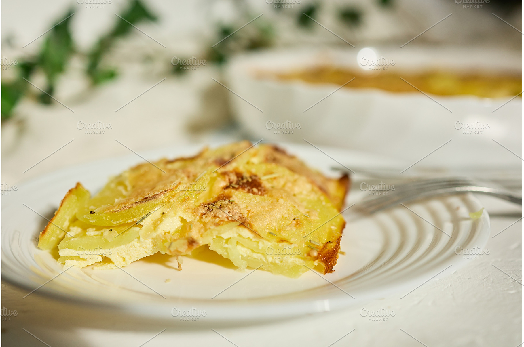 Creamy potato dish served in a cozy, a Food & Drink Photo by IlliaBondarPhotography