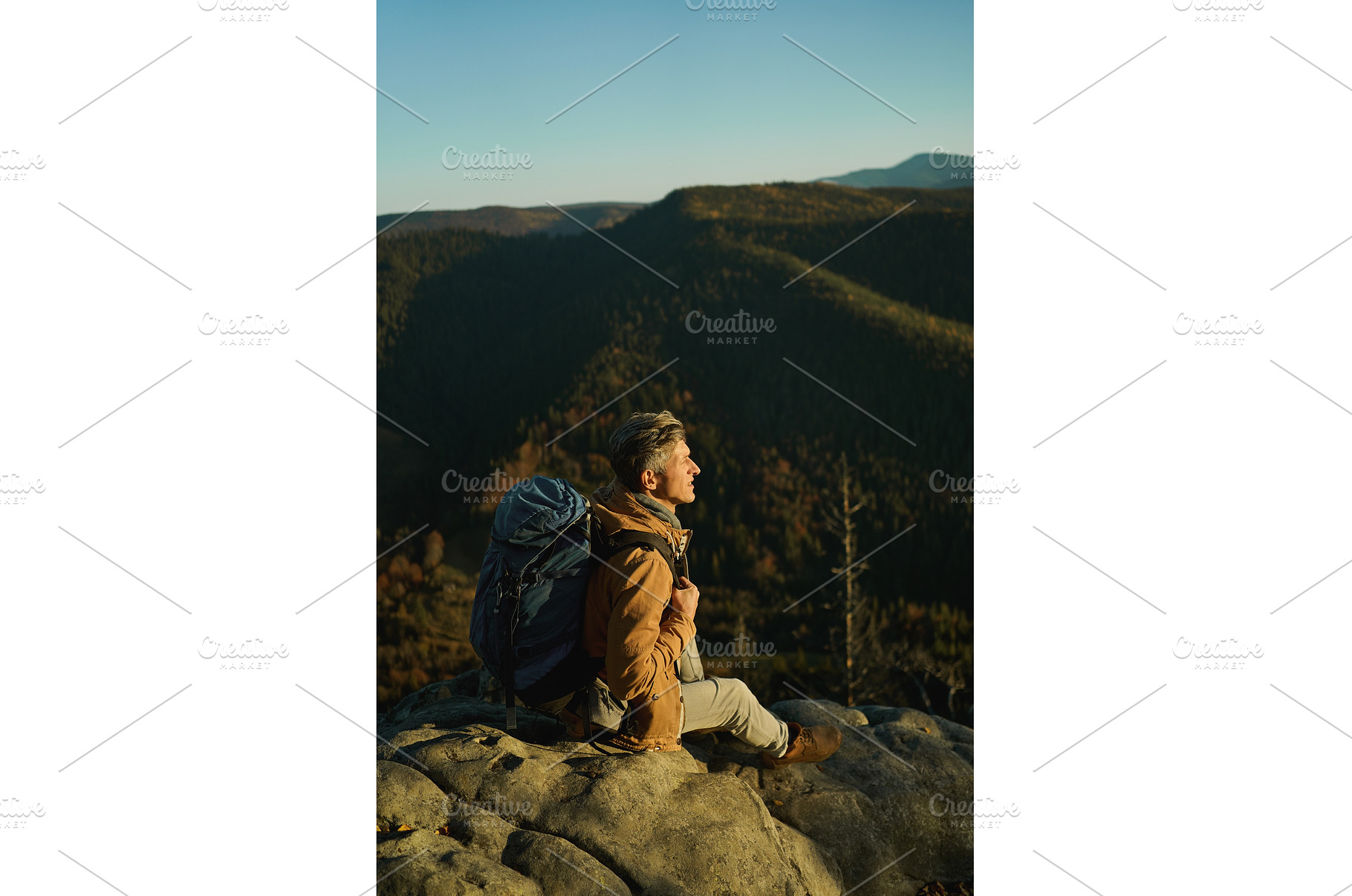 Tired and inspired hiker man sitting, a Nature Photo by vitaliymateha photography