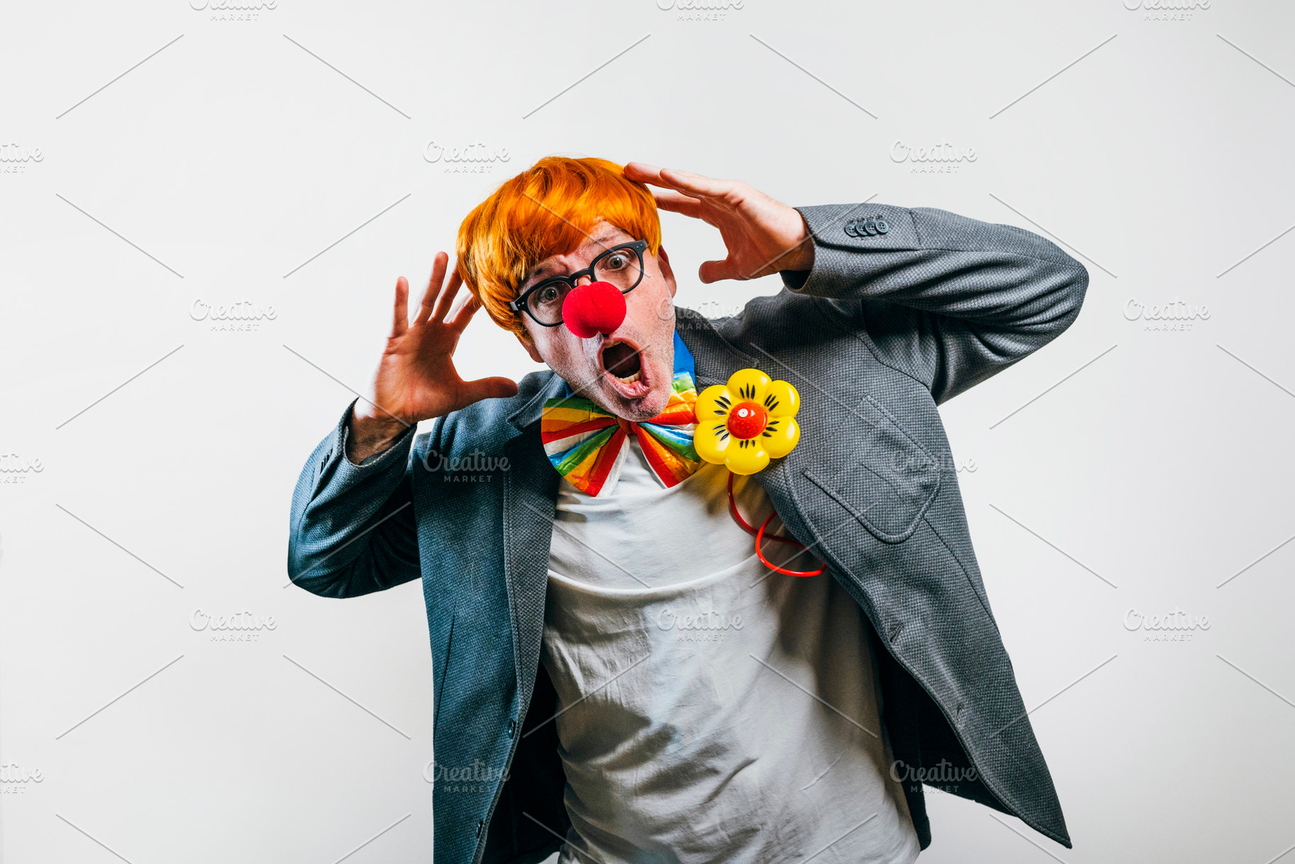 Funny clown making silly face with red nose, a Person Photo by karrastock
