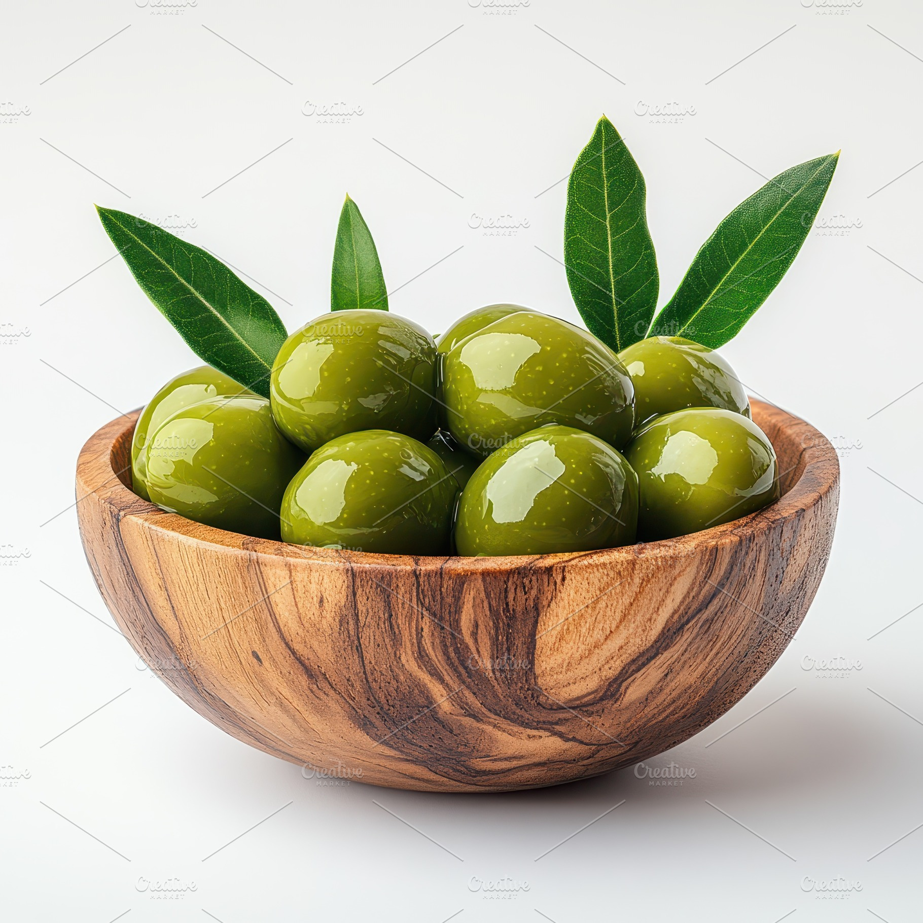 Green olives in wooden bowl with lea, a Food & Drink Photo by Pixeness Studio