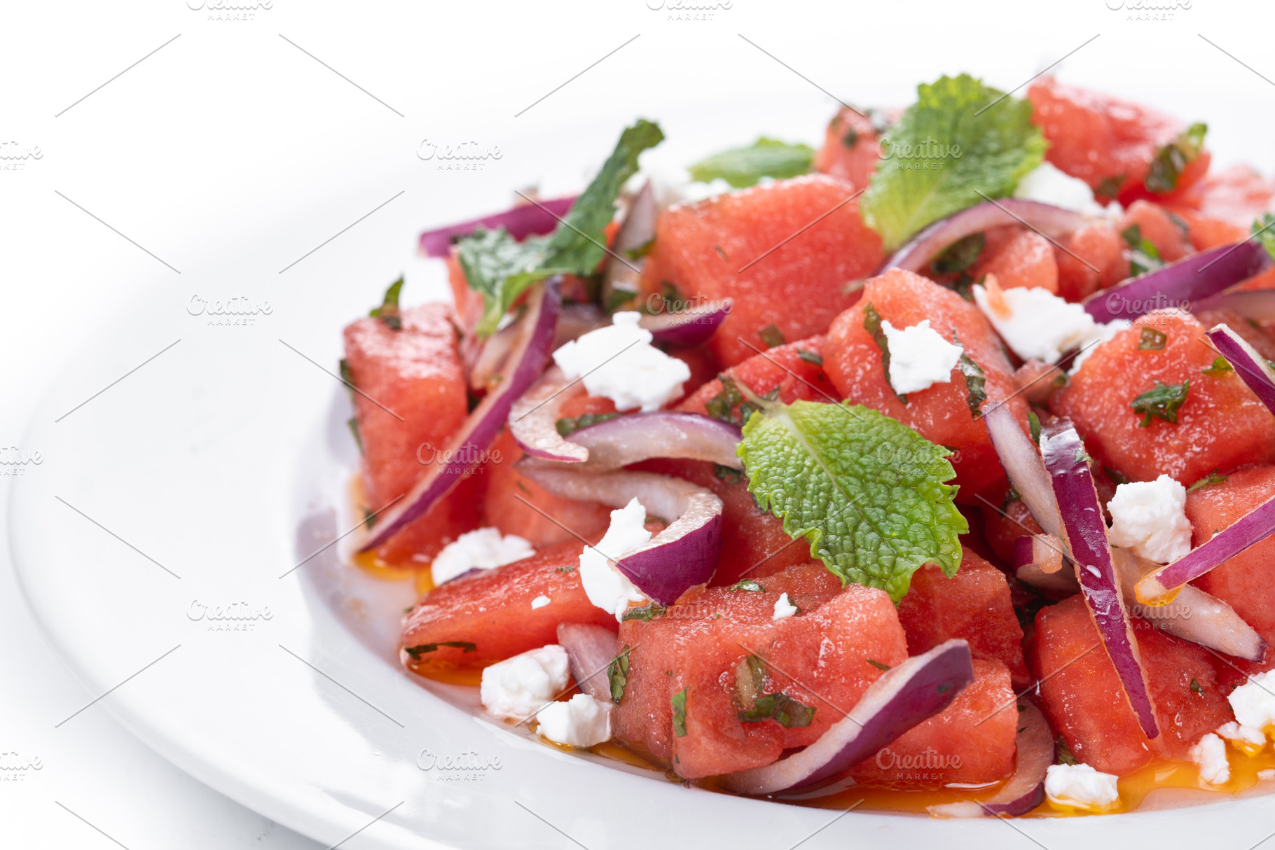 Fresh Watermelon Feta Salad with Mint and Red Onion isolated on white backgroun, a Food & Drink Photo by etorres69