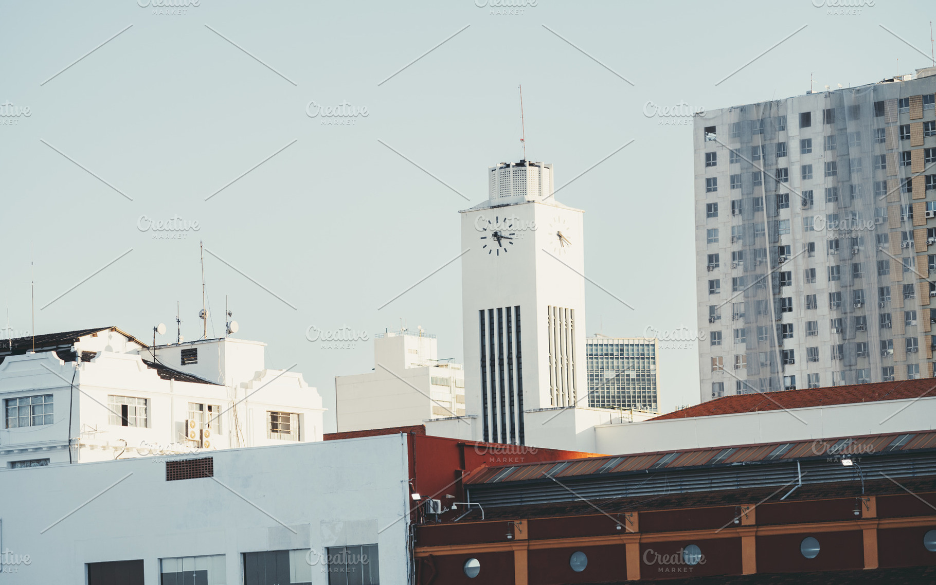 White clock tower in city skyline, an Architecture Photo by SkyNext