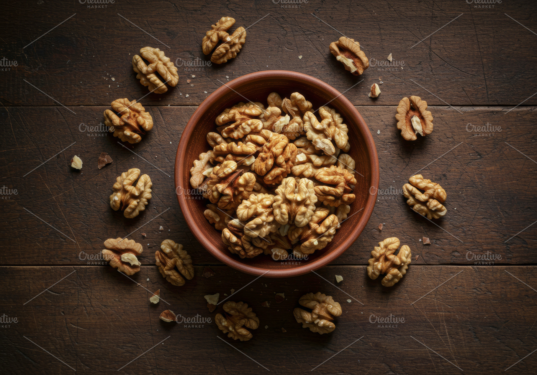 Shelled walnut halves in a wooden bo, a Food & Drink Photo by professorinc