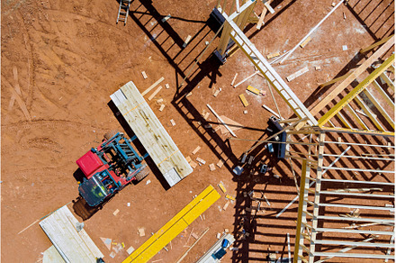 Lift manipulator unloads wooden, an Industrial Photo by Ungvar Studio