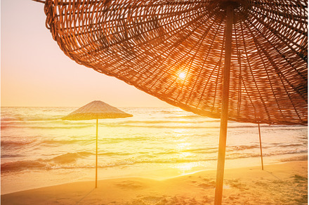 Wicker Beach Umbrella At, a Nature Photo by Our Amazing World