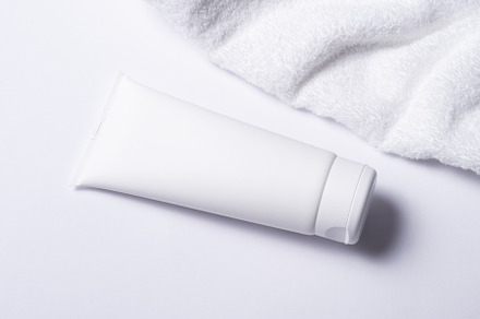 White plastic tube for cosmetic with terry towel, minimalistic c