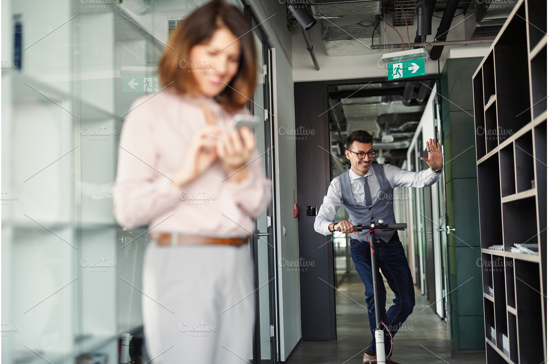 Man riding scooter in modern office, a Person Photo by HalfPoint