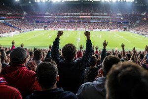 Crowd cheers during a soccer match, a Photo by Beautiful things