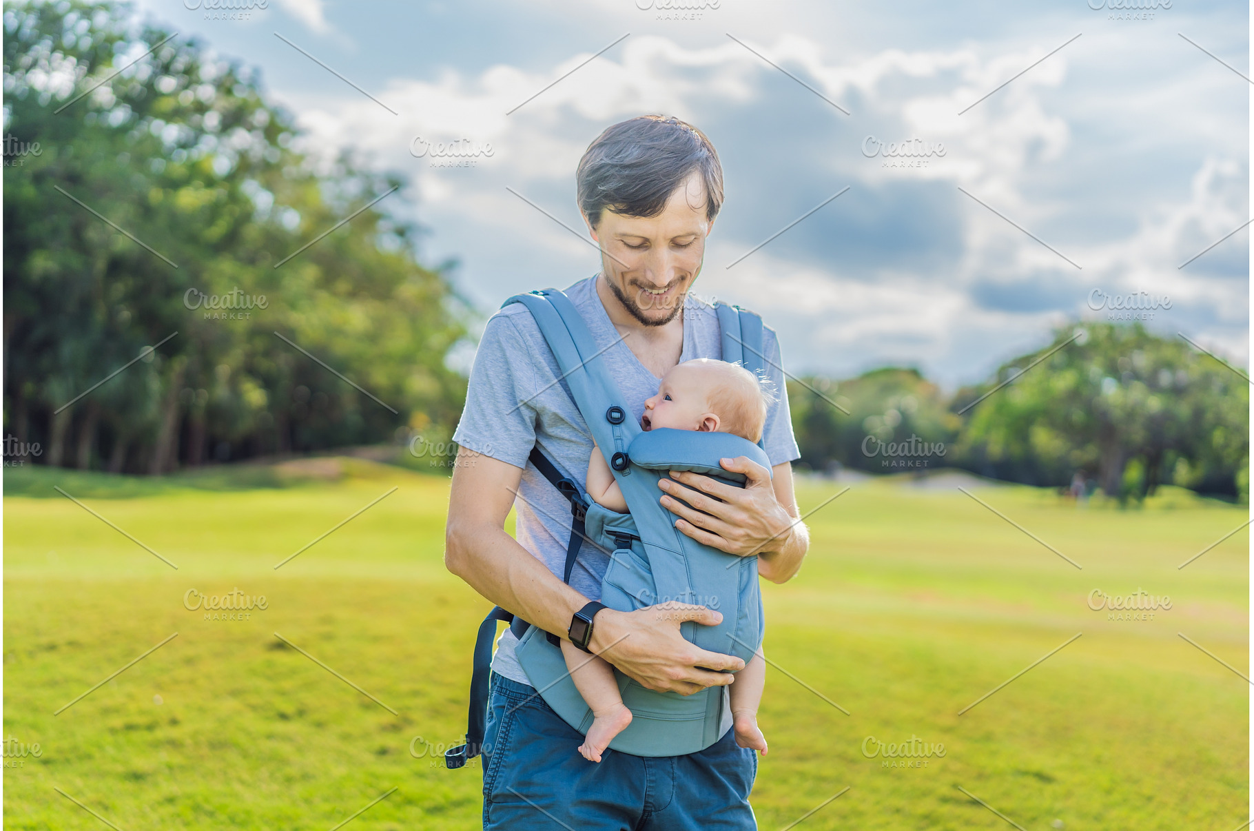 Young father walks in nature with, a Person Photo by Elizaveta Galitskaya