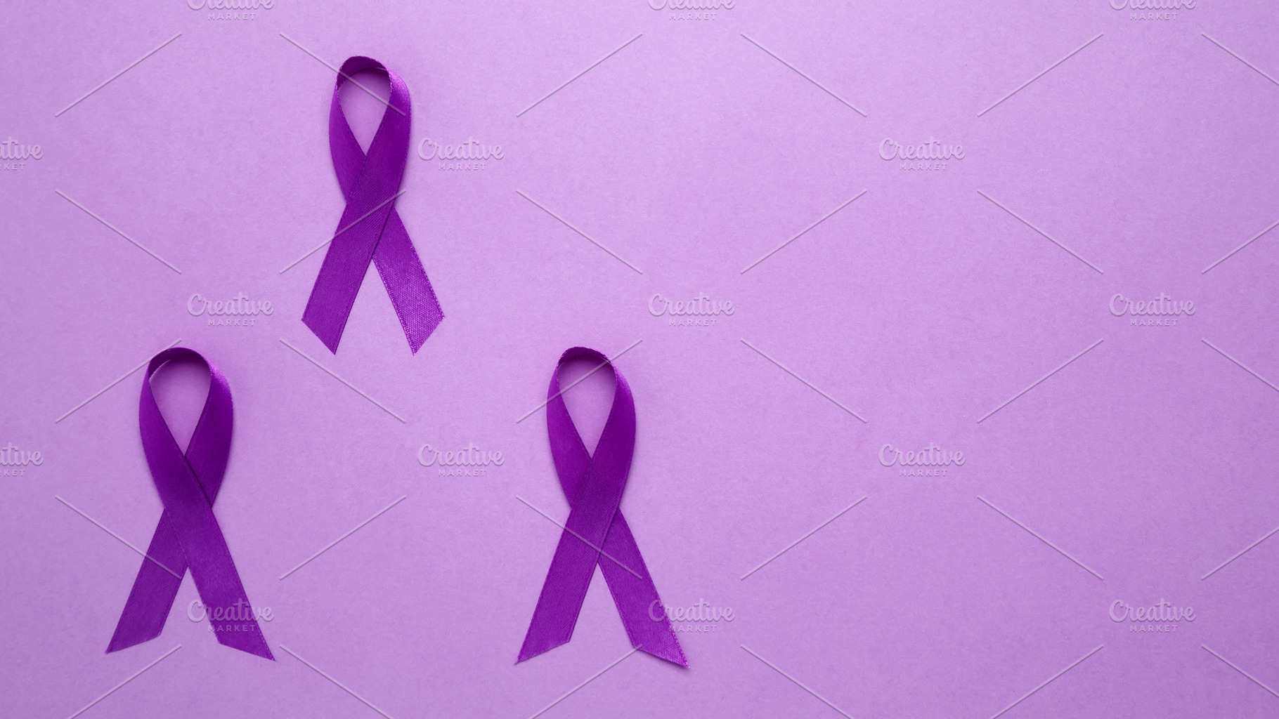 Purple ribbon held, symbol of support. Purple Epilepsy Awareness Day, a ...