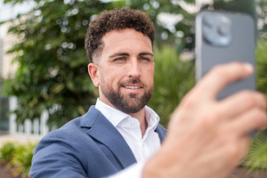 Businessman using smartphone for video call, a Business Photo by etorres69