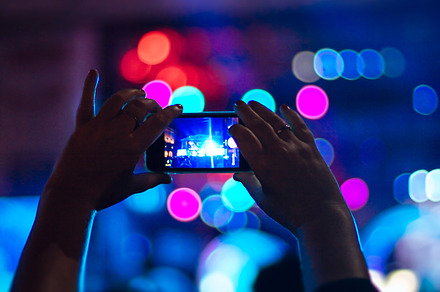 Taking photo in a concert containing concert, phone, and smartphone, an Arts & Entertainment Photo by OSORIOartist