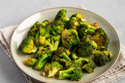 Homemade Pan-Fried Broccoli on a Plate, side view., a Food & Drink Photo by LiudmylaChuhunova