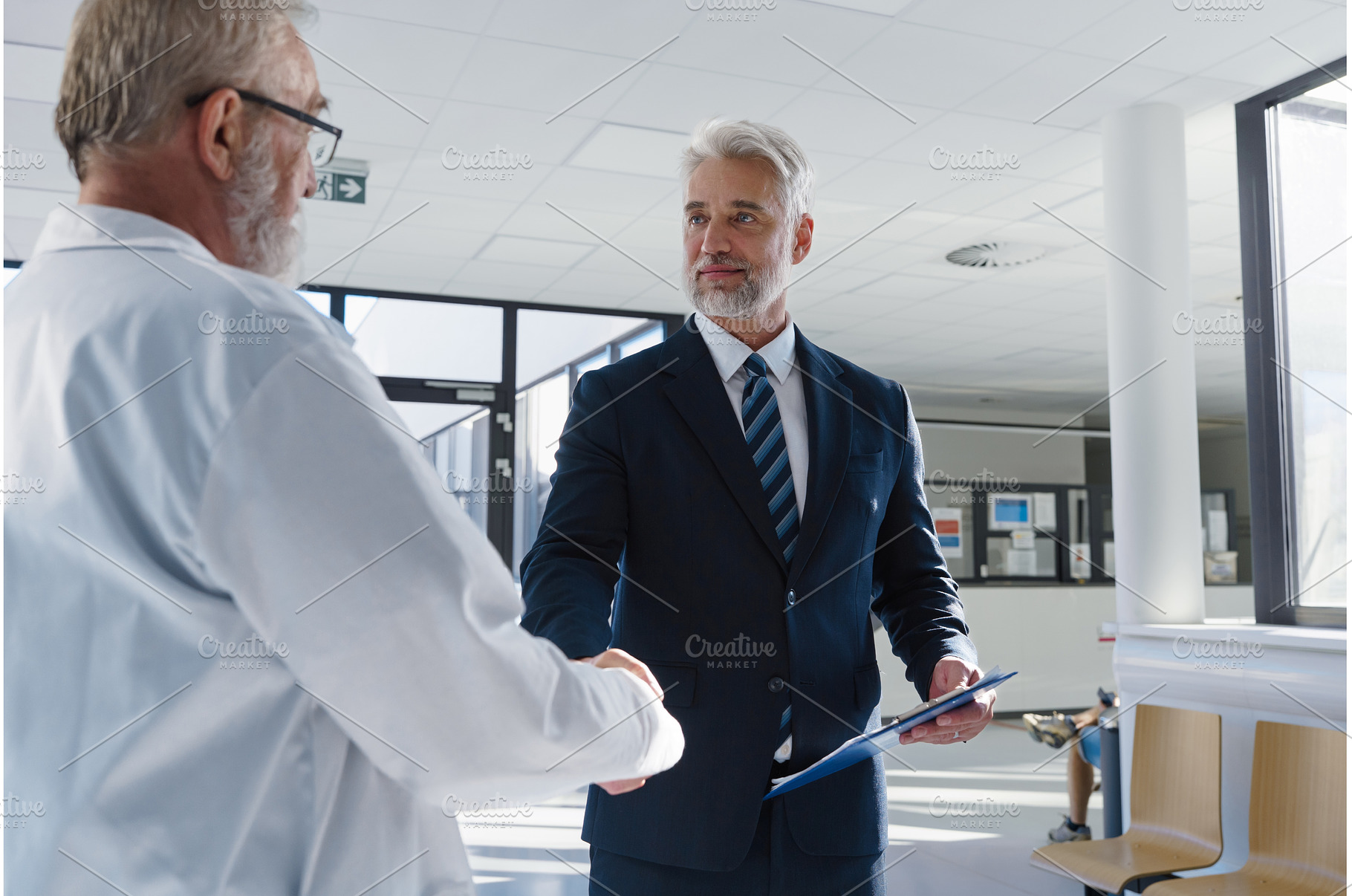 Portrait of manager shaking hand, a Health & Medical Photo by HalfPoint