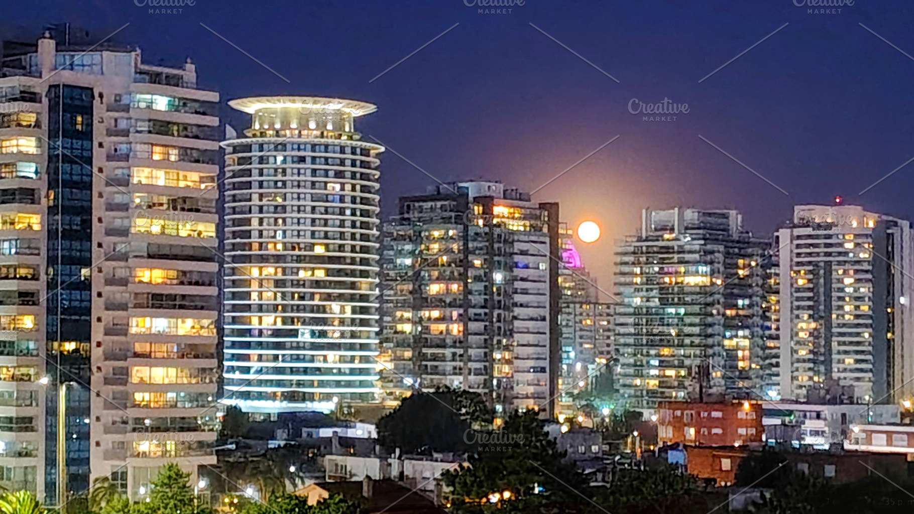 Apartment buildings night urban scene, punta del este city, urug, an Architecture Photo by DanFLCreativo