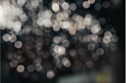 Black abstract bokeh background, an Abstract Photo by Yummypic