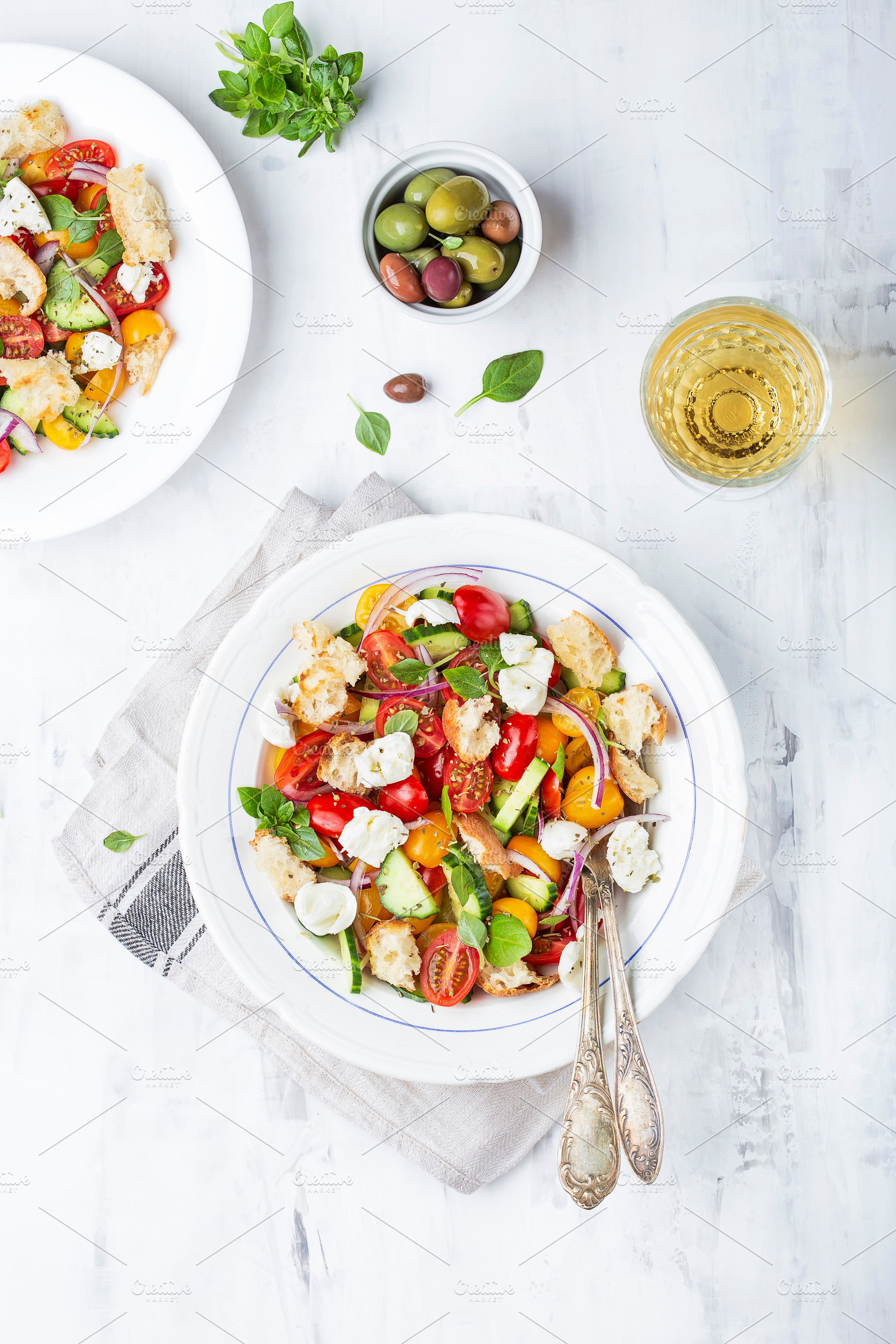 Italian traditional salad panzanella containing antipasto, appetizer, and, a Food & Drink Photo by Marina_Pronina