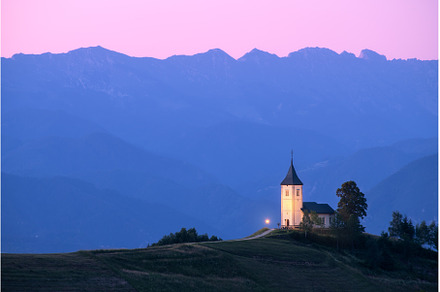 Church on a hill at dusk with, a Nature Photo by den-belitsky