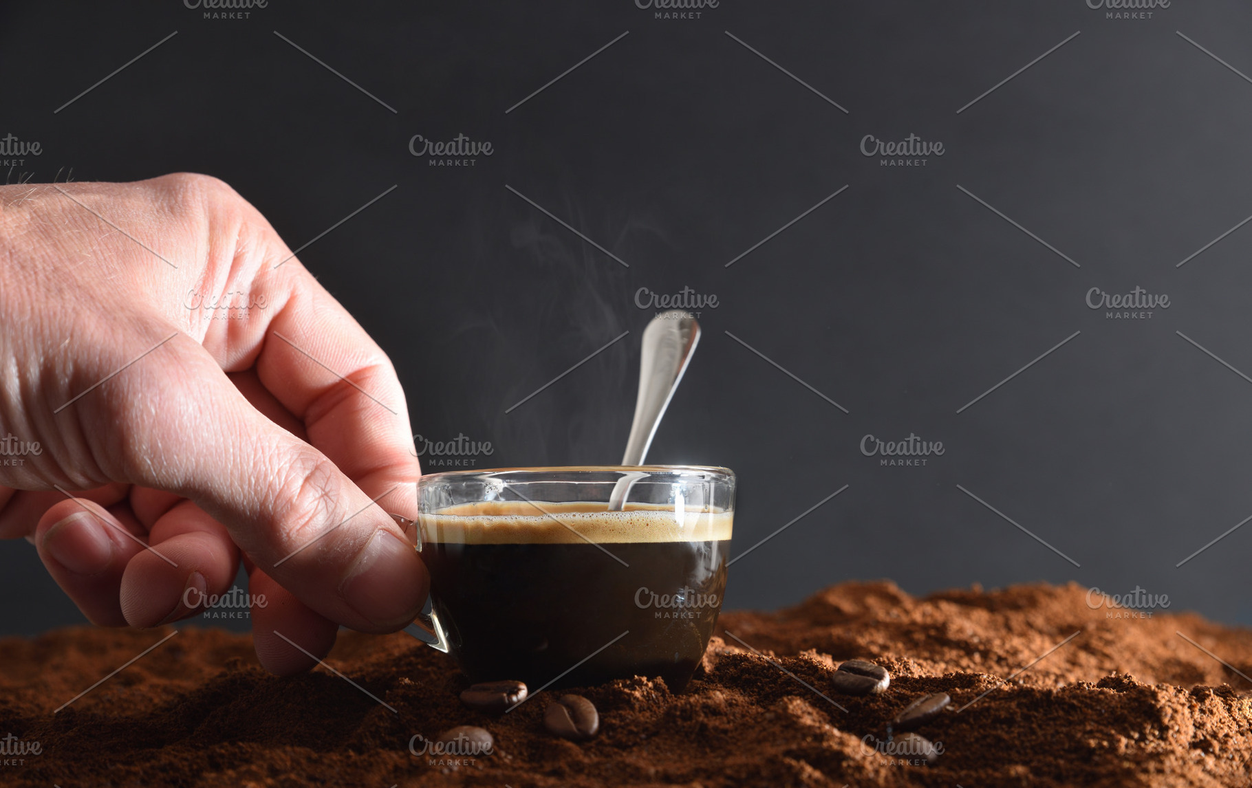 Hand holding cup with hot coffee on ground coffee, a Food & Drink Photo by Davizro's Market