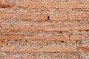 Old wall of elongated reddish-brown bricks joined with gray ceme, an Abstract Photo by Davizro's Market