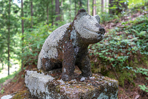 Bear statue in Hida Minzoku Mura Folk Village forest, Takayama, an Architecture Photo by GoodGoods
