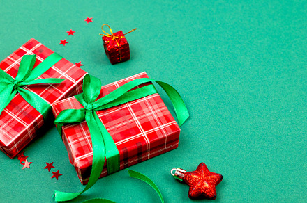 Christmas composition. Red gift boxes with green ribbon at green, a Holiday Photo by vimart