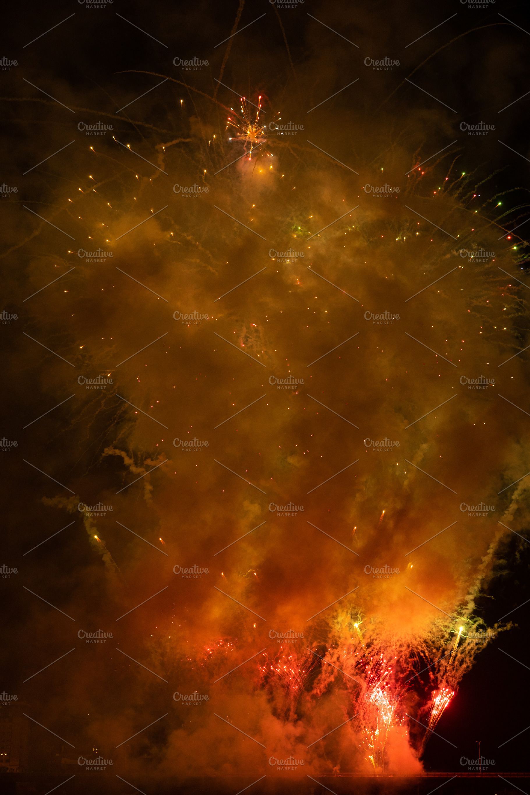 Fireworks exploding behind a wall of smoke, a Holiday Photo by rubenchase
