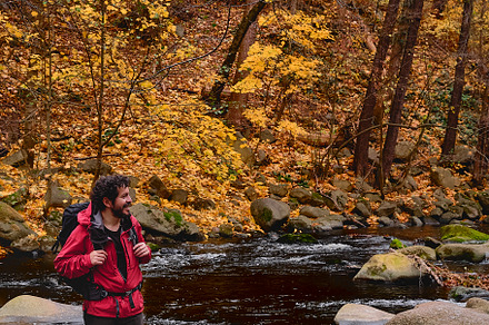 Hiking man in river