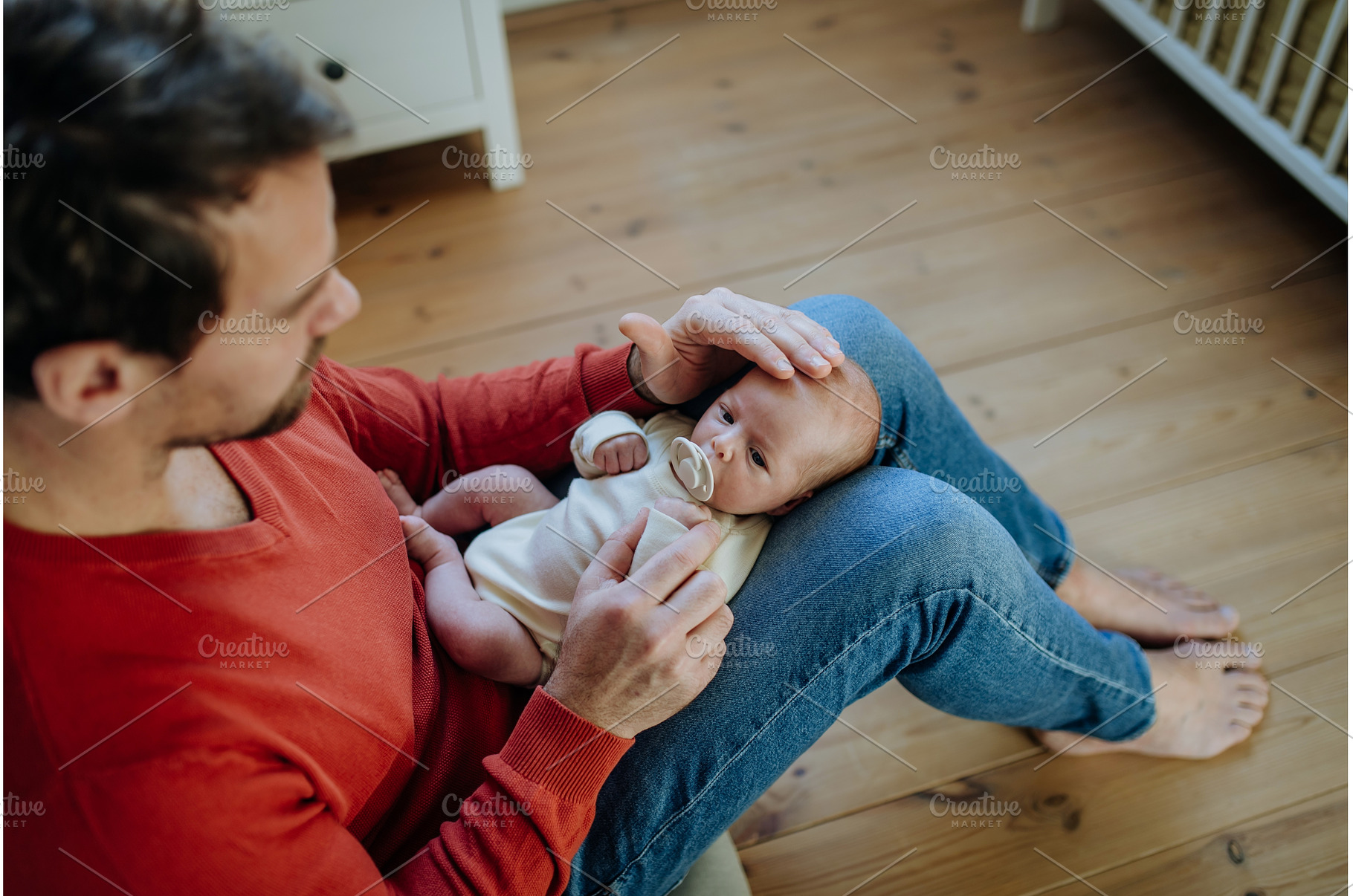Close-up of father holding his, a Person Photo by HalfPoint
