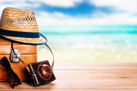 Vintage suitcase, sunglasses and hipster hat wooden deck and blu, a Holiday Photo by hitdelight