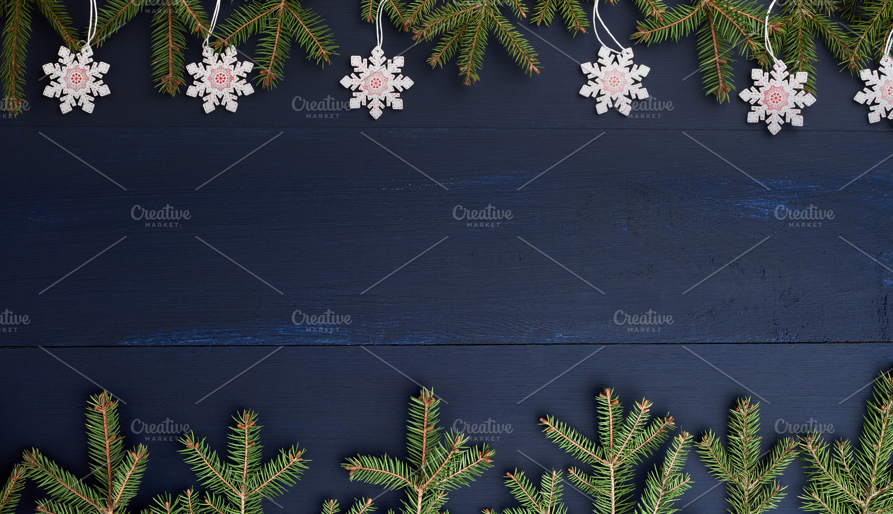 Wooden Christmas background with fir branches and snowflakes on, a Holiday Photo by ndanko