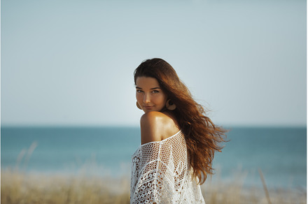 Woman Resting on the Beach During, a Holiday Photo by Emotion photo
