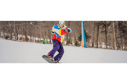 Young man jumping with a snowboard, a Sports & Recreation Photo by Elizaveta Galitskaya