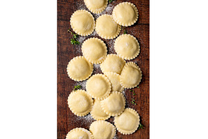 Fresh Ravioli Pasta on Wooden Board, a Food & Drink Photo by Natasha Breen
