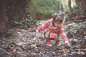 Little girl in the forest featuring path, garden, and nature
