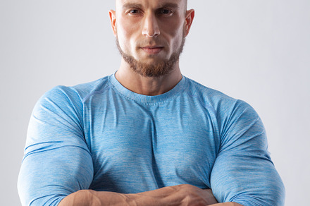 Portrait of a muscular male model on containing male, young, and model