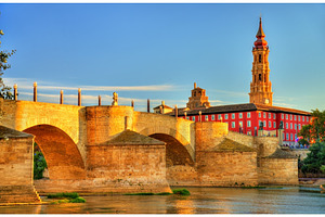 Puente de piedra in zaragoza spain featuring zaragoza, river, and spain, an Architecture Photo by Leonid Andronov