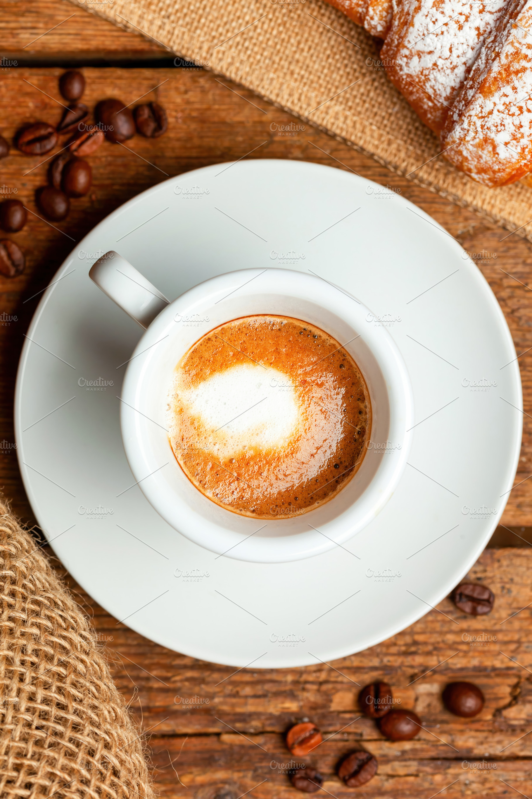 Delicious italian breakfast with espresso macchiato and croissant on wooden tab, a Food & Drink Photo by Antonio Gravante Market