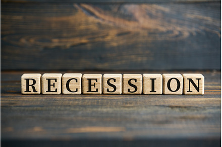 The word RECESSION on wooden cubes