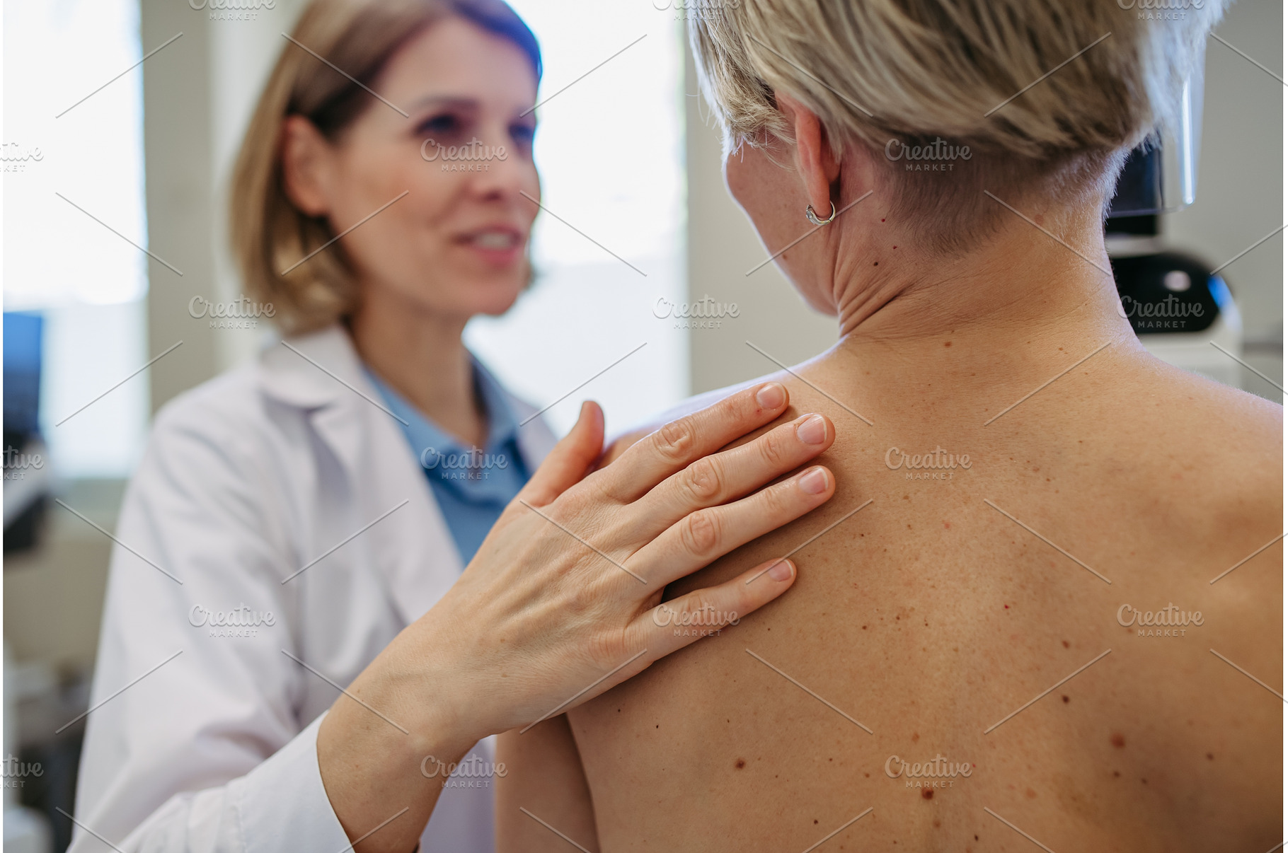 Radiologist comforting patient, a Person Photo by HalfPoint